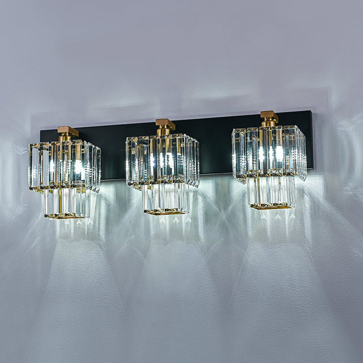 Luz de tocador glamurosa con 4 luces, cristal y marco dorado cuadrado.