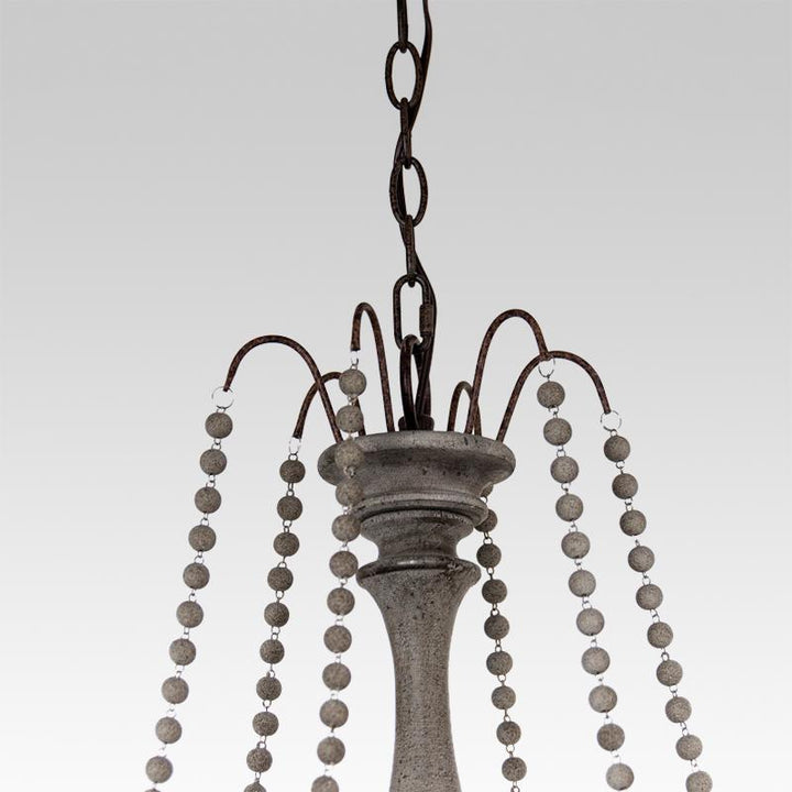 Candelabro de velas de madera con diseño vintage, color gris/blanco, para ambientes rústicos.