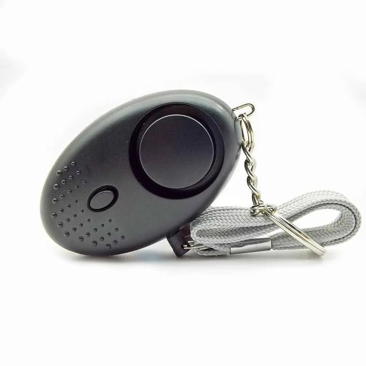 Dispositivo de seguridad personal LED. Alarma sonora para disuadir amenazas, esencial para viajes y protección.