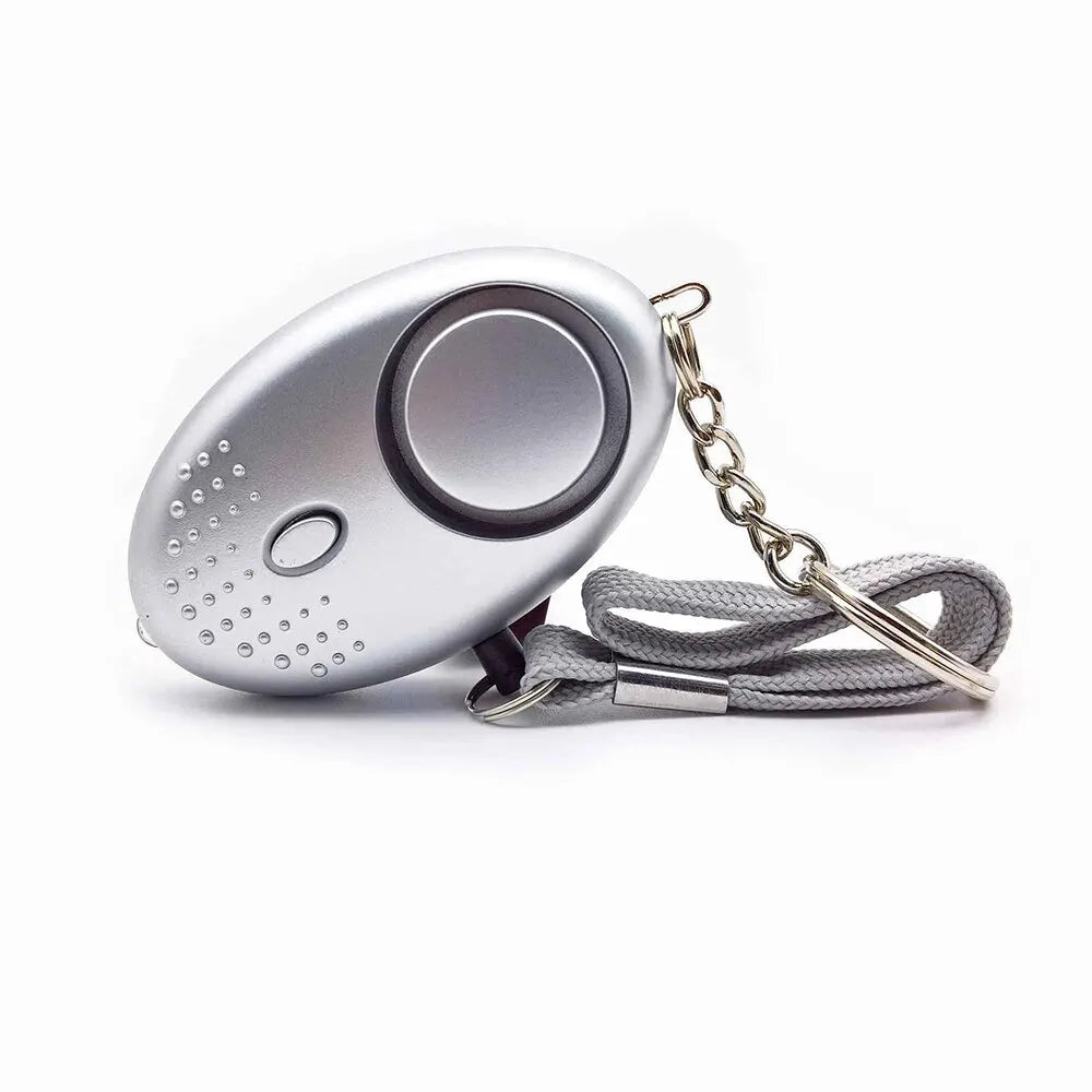Linterna LED integrada en alarma de autodefensa portátil. Protección personal para hombres y mujeres.