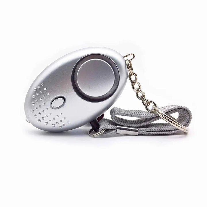 Linterna LED integrada en alarma de autodefensa portátil. Protección personal para hombres y mujeres.