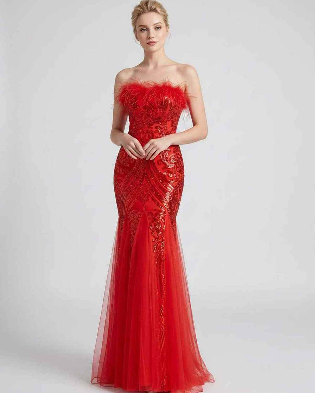 Vestido de noche off-shoulder con lentejuelas, plumas y corte maxi. Muy elegante.