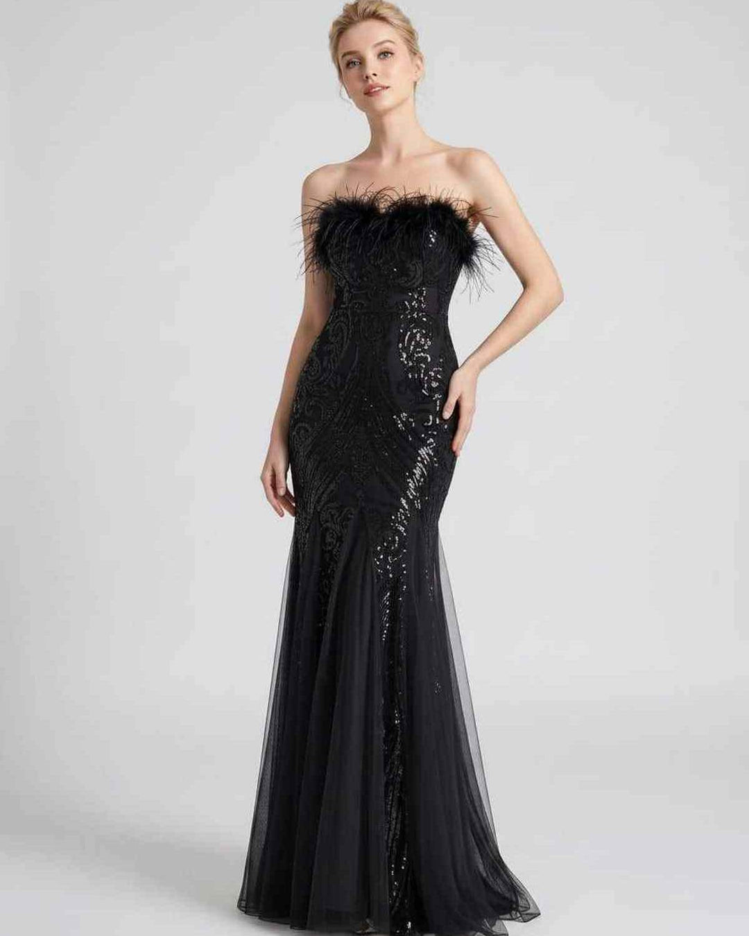 Vestido de noche para mujer, lentejuelas y plumas, corte sirena. Ideal para deslumbrar.