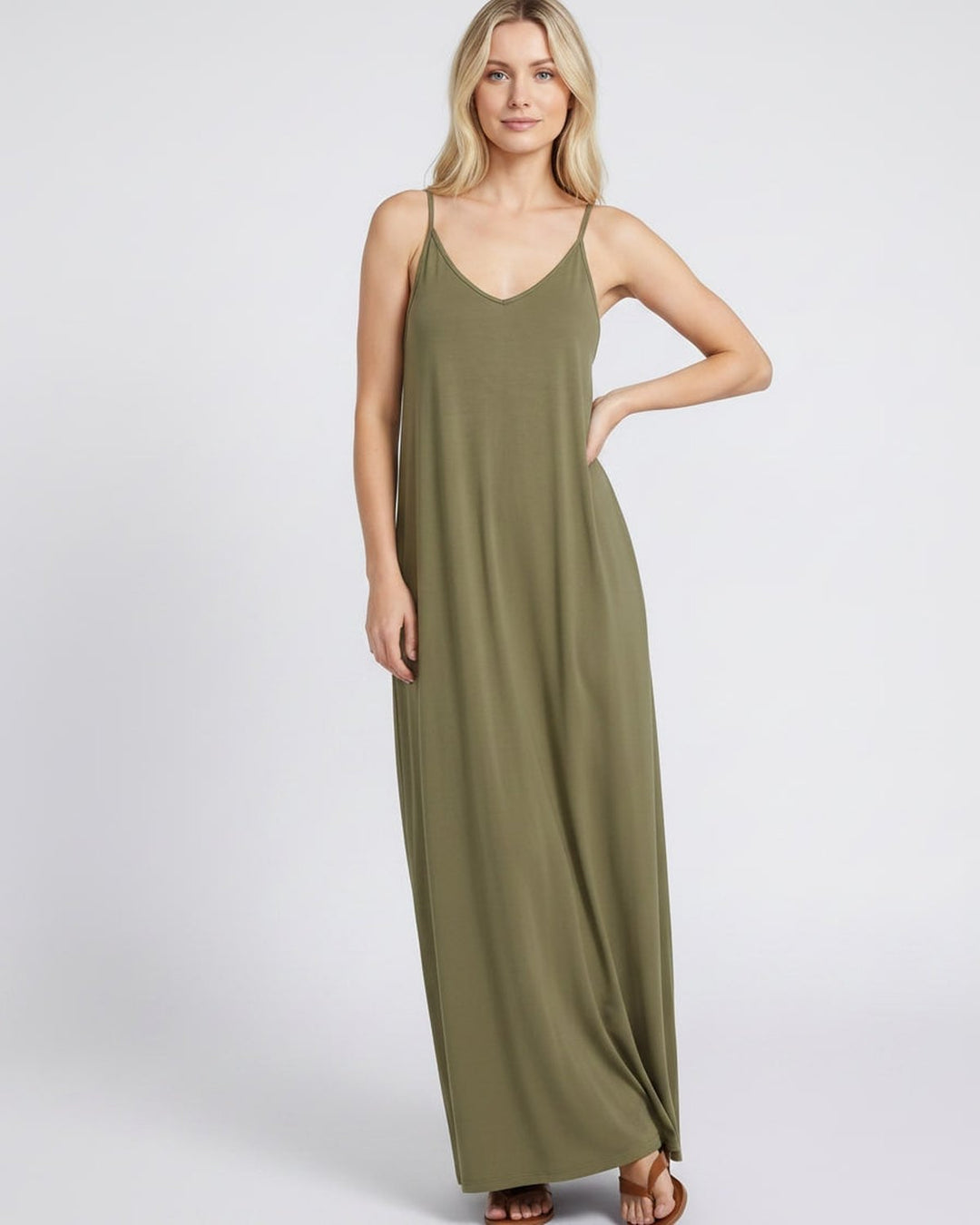 Vestido veraniego fluido con escote V, sin mangas y bolsillos, muy versátil para mujer.