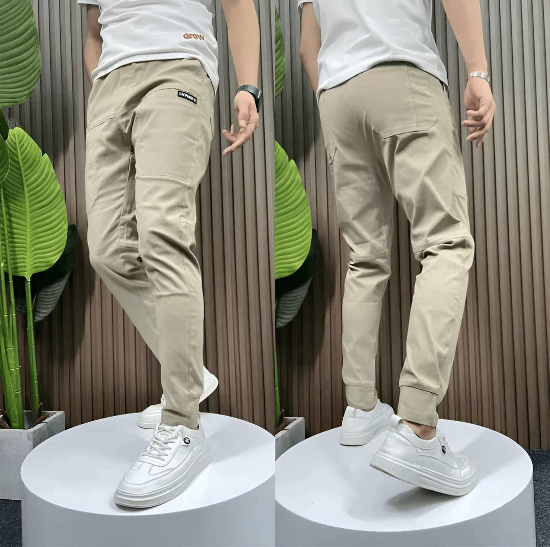 Cómodos pantalones cargo para hombre con bolsillos y tejido elástico, ideales para el día a día.