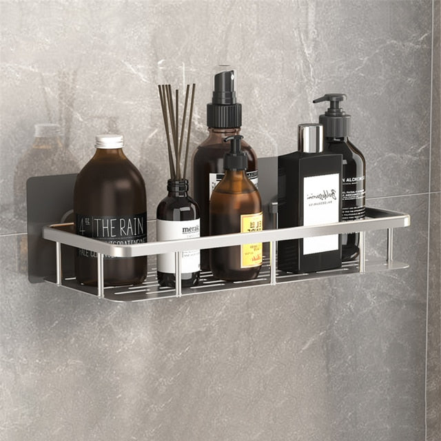 Soporte de baño con ventosa, estante negro para organizar botellas y jabones en la ducha.
