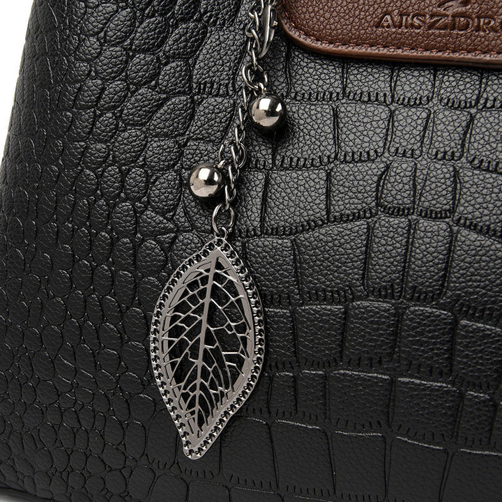 Bolso de cuero genuino para mujer, elegante y versátil, con correa ajustable.