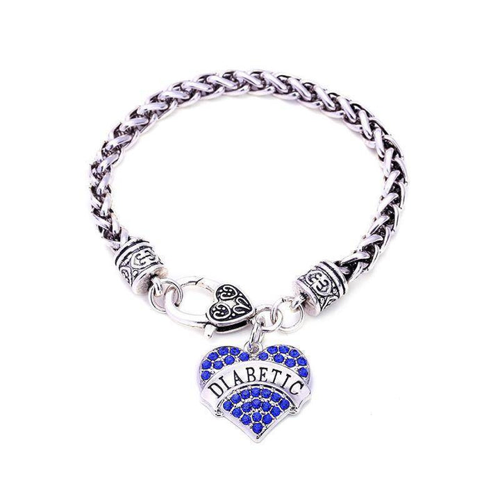 Pulsera de identificación médica para emergencias de diabetes, mujer. Diseño con corazón y cristal, brindando protección.