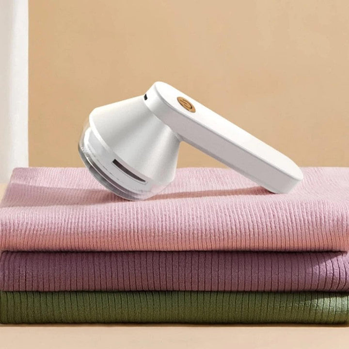Máquina quitapelusas eléctrica para restaurar y cuidar ropa y tejidos. Deja tus prendas como nuevas.