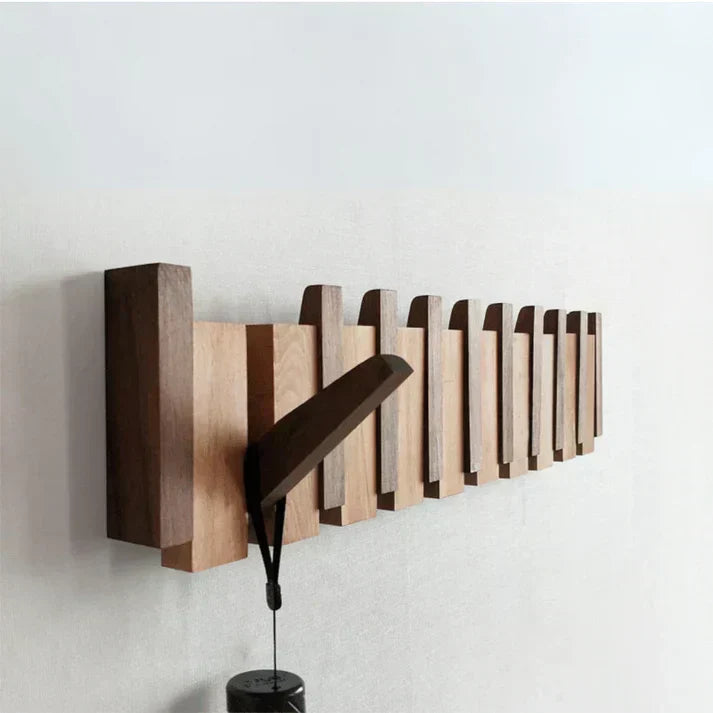 Perchero de pared moderno, diseño piano, madera de nogal, para una entrada elegante y organizada.