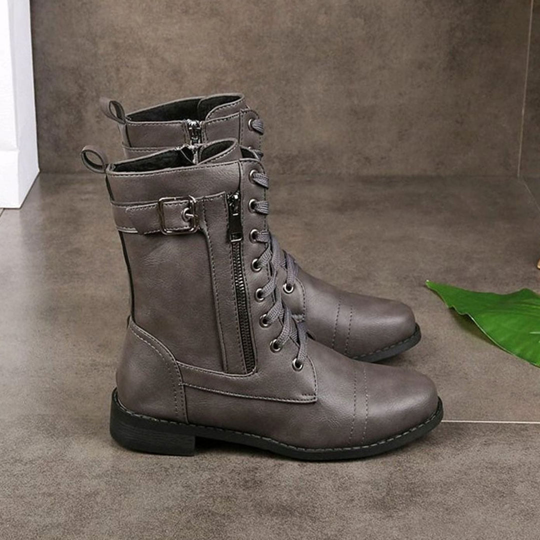 Botines urbanos de mujer, estilo militar, con cordones y cremallera, perfectas para el día a día.