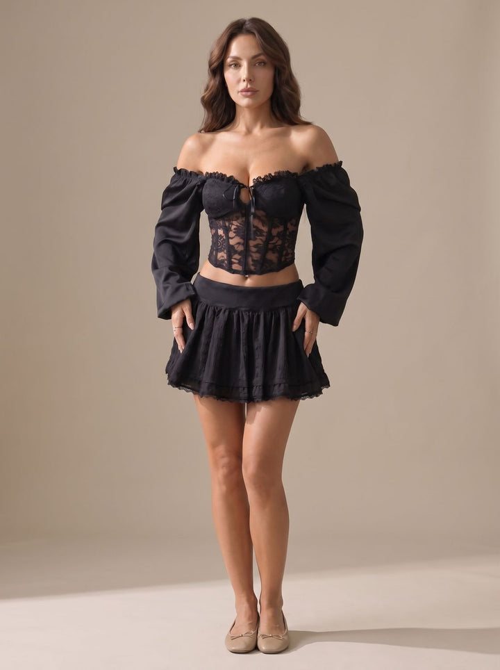 Top corsé mujer negro con hombros descubiertos y manga globo. Ideal para noche elegante, fiesta y citas.