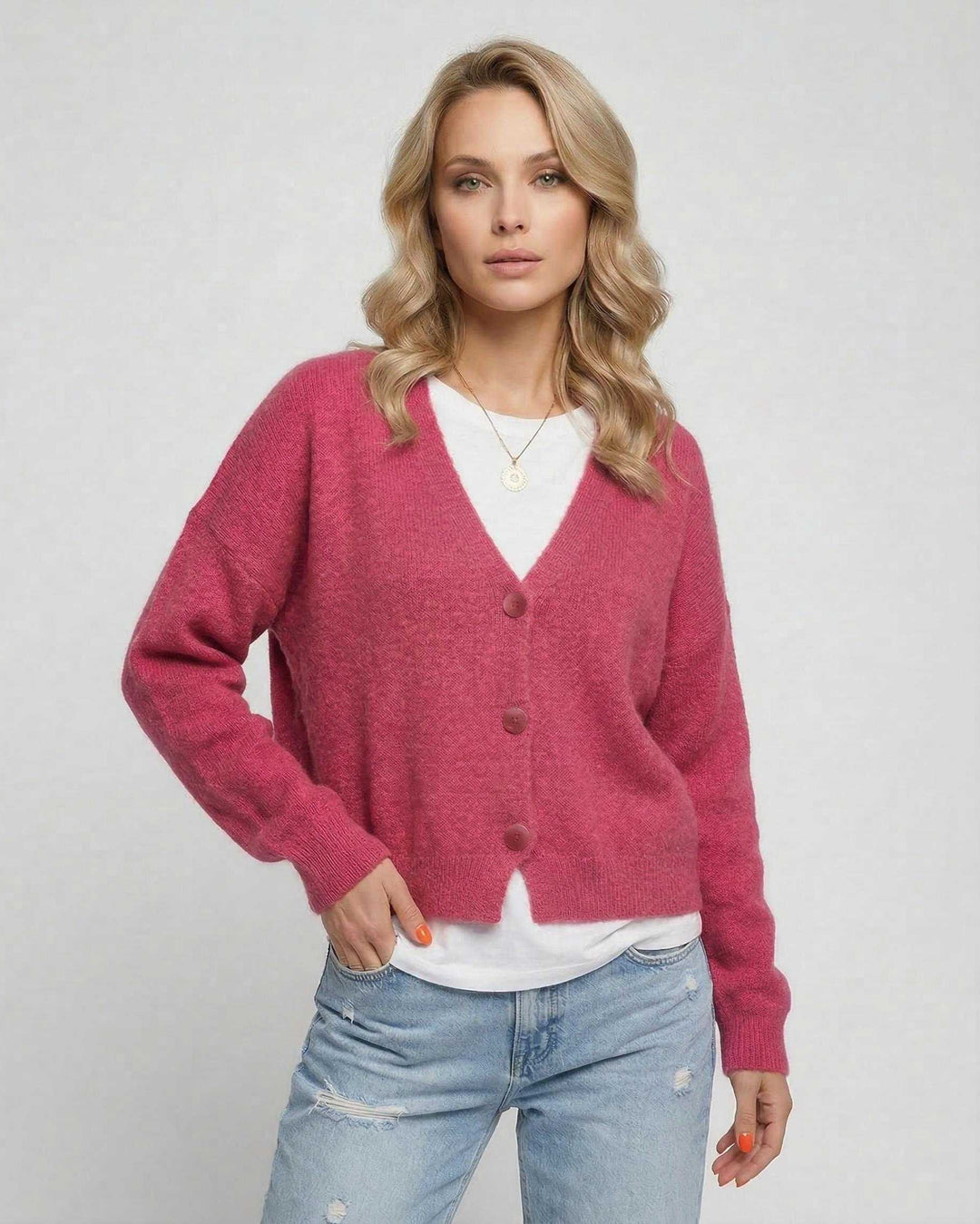 Cárdigan de mujer rosa, corte relajado y muy cómodo. Perfecto para un look casual femenino y chic en otoño.