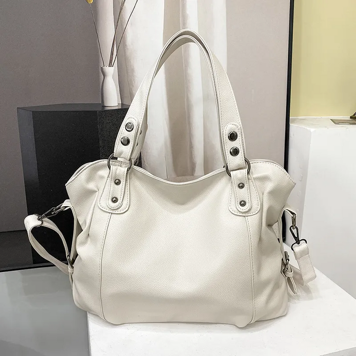 Bolso blanco grande para mujer, de cuero vegano suave. Ideal para un look diario chic y organizado.