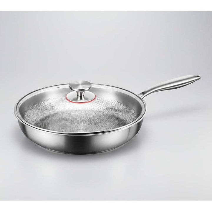 Menaje de cocina: sartén antiadherente martillada de titanio, base plana, perfecta para cocción diaria.