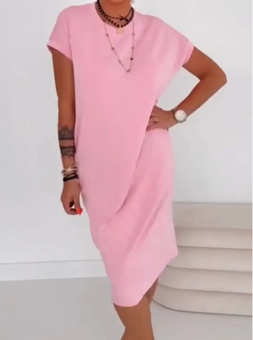 Vestido midi casual negro para mujer, con bolsillos, cómodo y corte relajado.