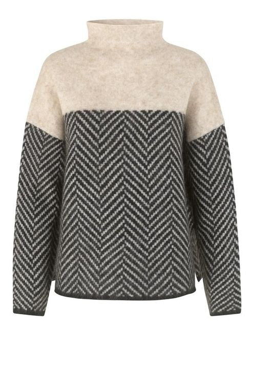 Suéter de algodón bicolor de cuello alto para mujer. Ofrece estilo y calidez, ideal para moda casual de invierno.