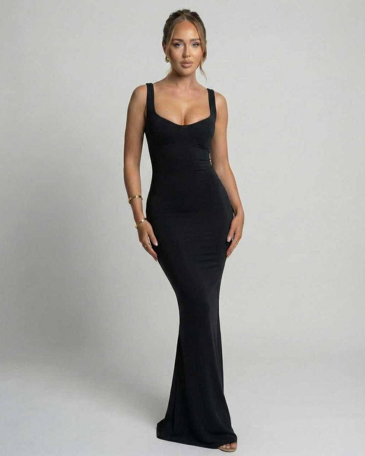 Vestido maxi negro elegante para mujer, silueta deslizante minimalista, ideal para noche y fiesta.