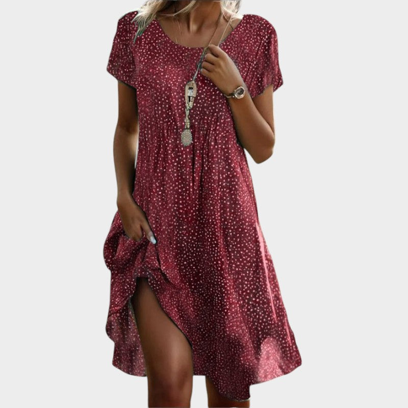 Elegante vestido midi de verano con escote pico y manga corta. Diseño fluido y cómodo para mujer.