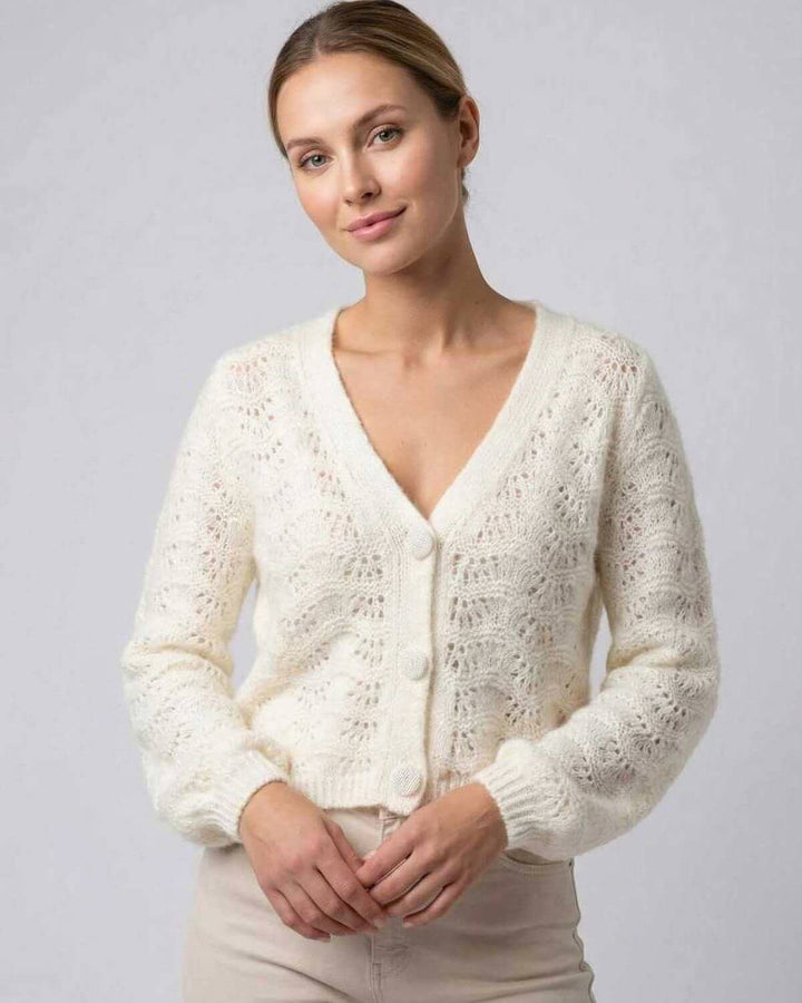 Cárdigan blanco de mujer con cuello en V, manga larga. Ideal para otoño e invierno, estilo casual y elegante.