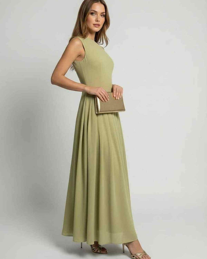 Vestido maxi verde salvia fluido, corte asimétrico para mujer. Perfecto para bodas y eventos especiales.