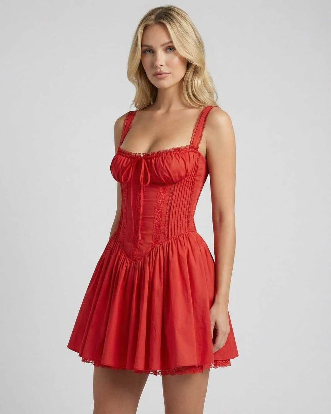Mini vestido elegante rojo con diseño A-line. Presenta encaje delicado y un lazo frontal. Perfecto para fiestas.