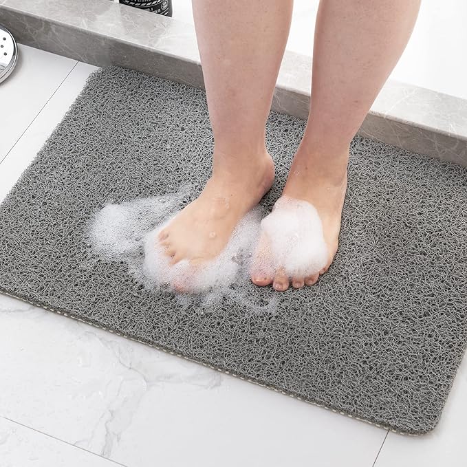Alfombra de ducha antideslizante y de secado rápido. Mantiene el suelo seco, ideal para seguridad en baños.