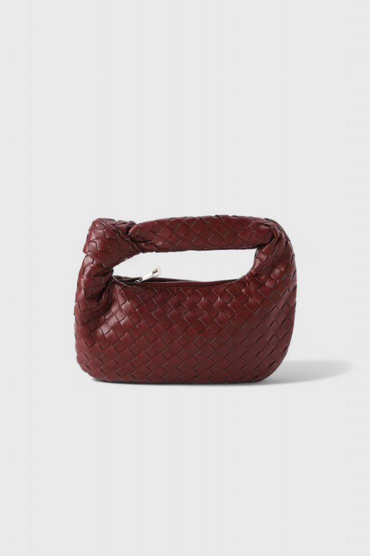 Accesorio de moda: mini bolso satchel elegante para mujer. Piel vegana tejida, un toque chic y compacto.