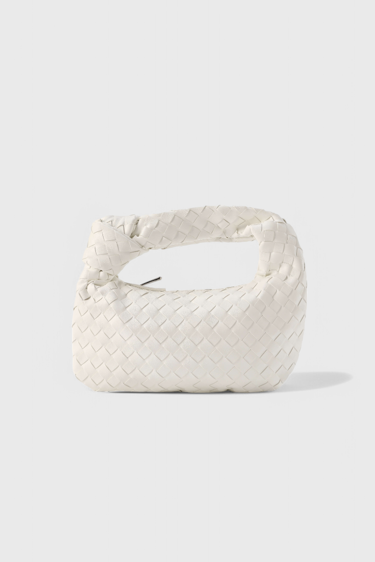 Mini bolso satchel de mujer, diseño tejido en piel vegana. Compacto, elegante y funcional para cualquier ocasión.