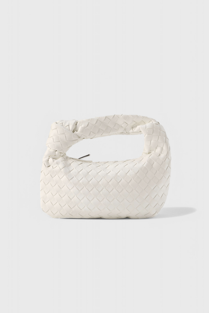 Mini bolso satchel de mujer, diseño tejido en piel vegana. Compacto, elegante y funcional para cualquier ocasión.