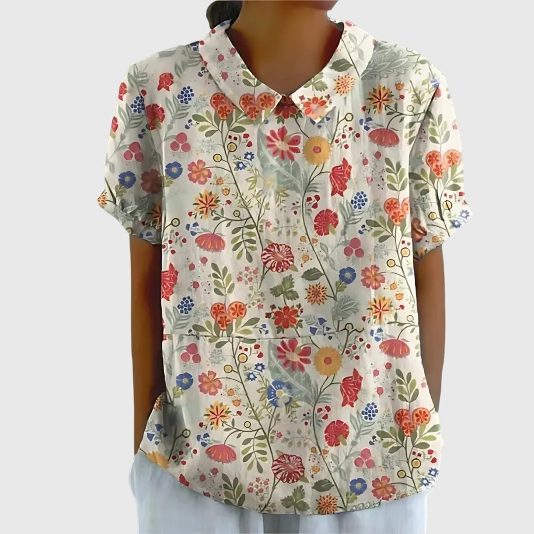 Blusa femenina de lino floral, diseño fresco y elegante para días cálidos de verano.