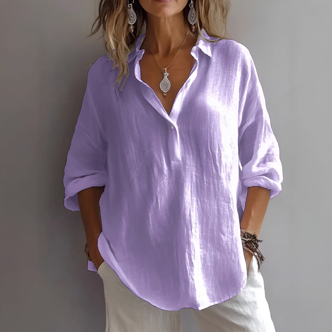 Blusa de mujer holgada y elegante con cuello V. Mangas ajustables para un look versátil, cómoda y de moda veraniega.