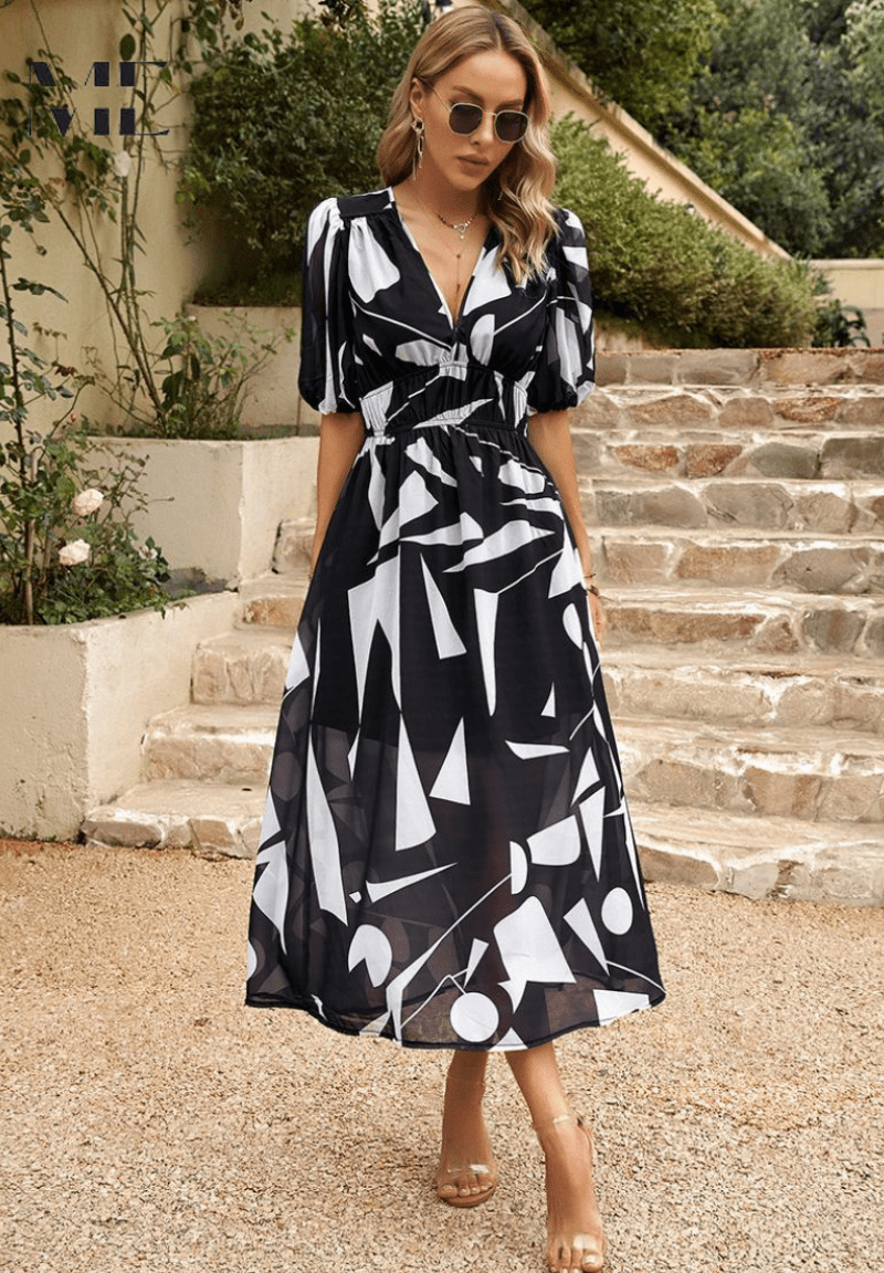 Vestido midi elegante con mangas abullonadas, escote V y silueta fluida. Perfecto para cualquier evento.