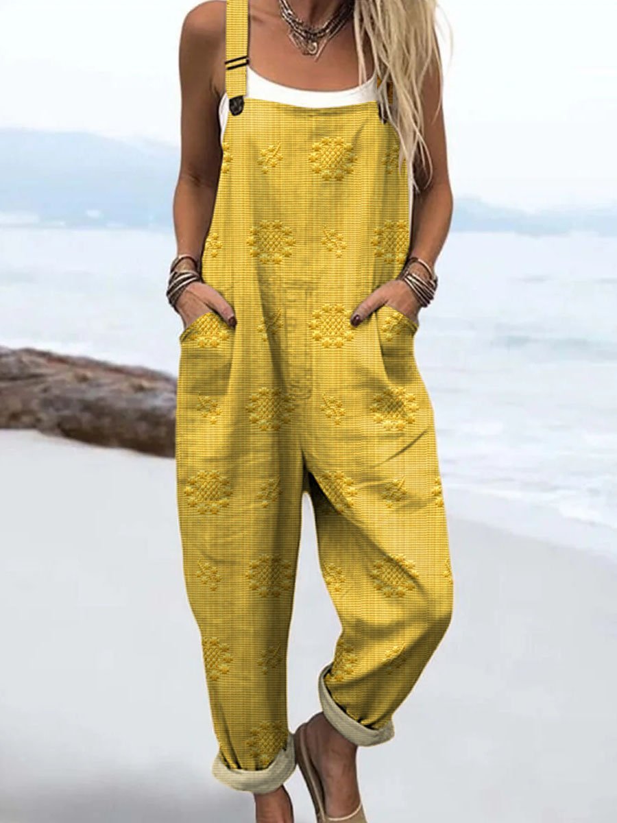 Mono de mujer con corte de pierna ancha, tirantes ajustables y prácticos bolsillos, estilo casual para verano.