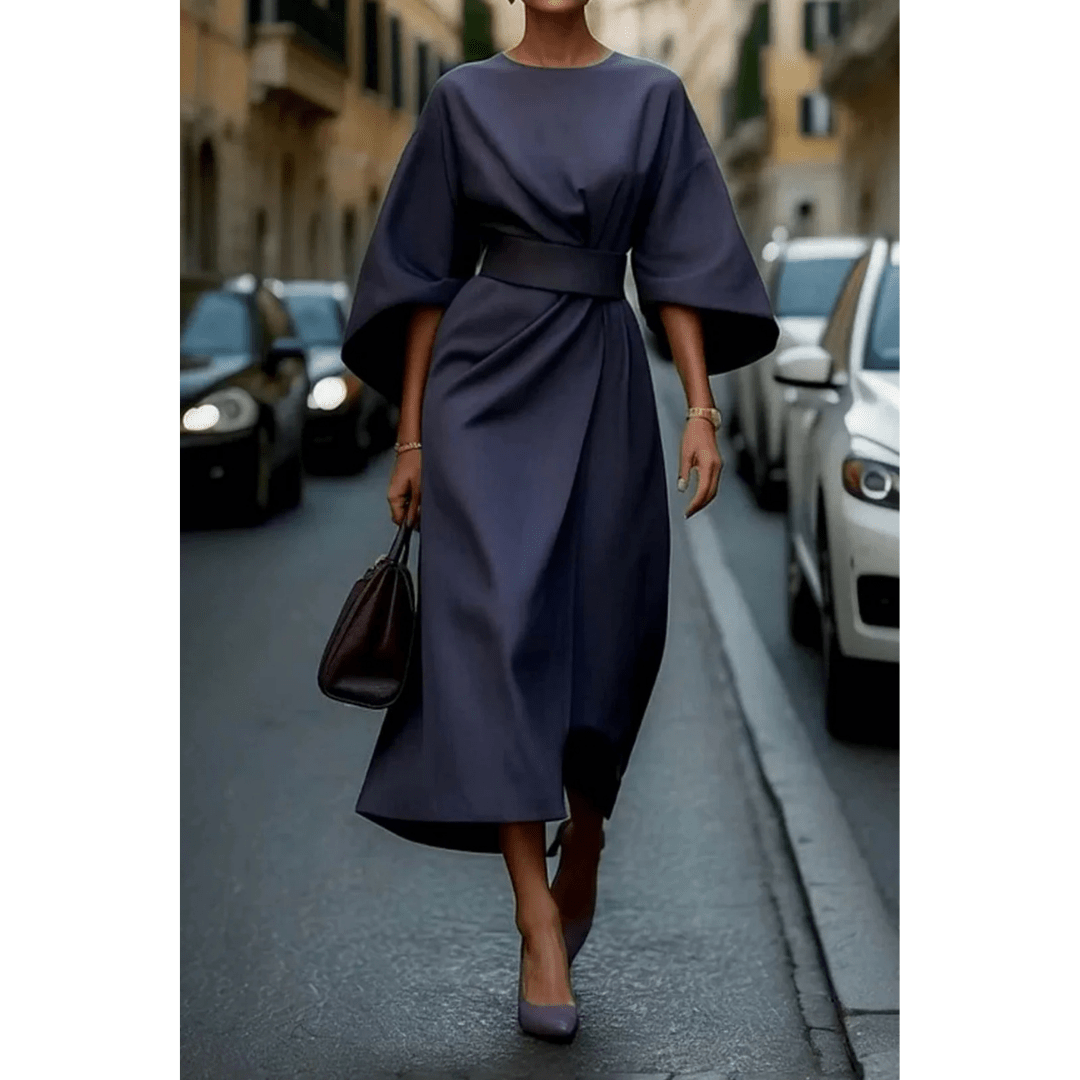 Moda femenina elegante: Vestido midi con mangas esculturales, ideal para ocasiones especiales y un estilo único.