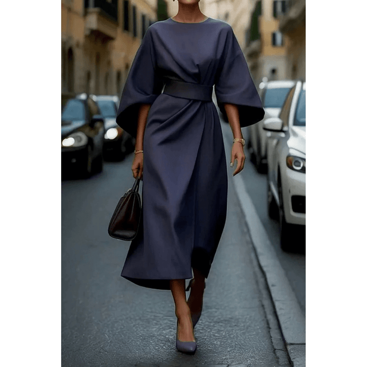 Moda femenina elegante: Vestido midi con mangas esculturales, ideal para ocasiones especiales y un estilo único.