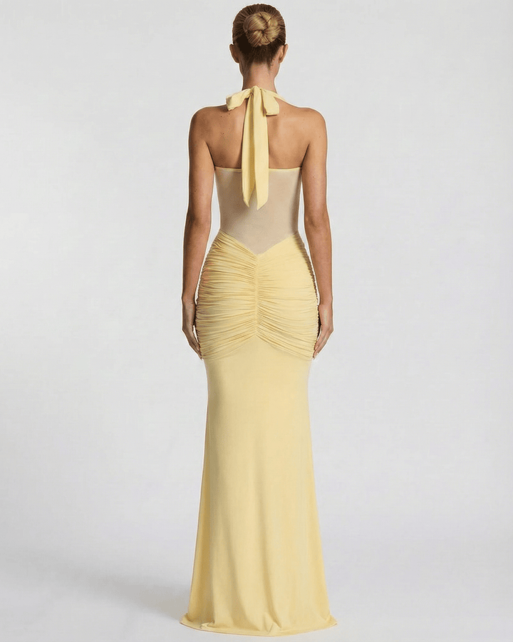 Vestido halter blanco sin mangas de mujer, corte maxi. Estilo sirena elegante para eventos de noche.
