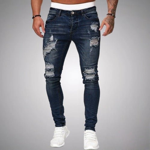 Jeans slim fit de hombre con diseño desgastado y lavado azul. Ropa casual y versátil para moda masculina moderna.