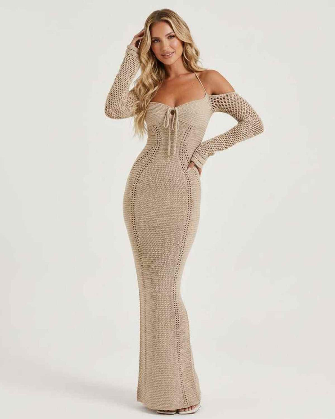 Vestido elegante de mujer con espalda descubierta y lazo en la cintura, silueta maxi para eventos.