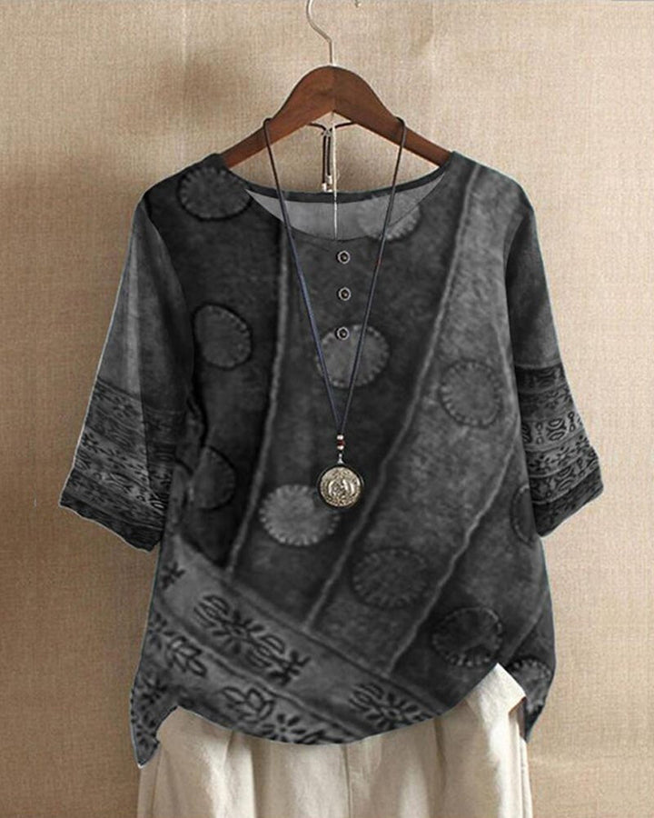 Blusa mujer retro bohemia, corte holgado y diseño asimétrico. Estampado vibrante para un look casual de verano.