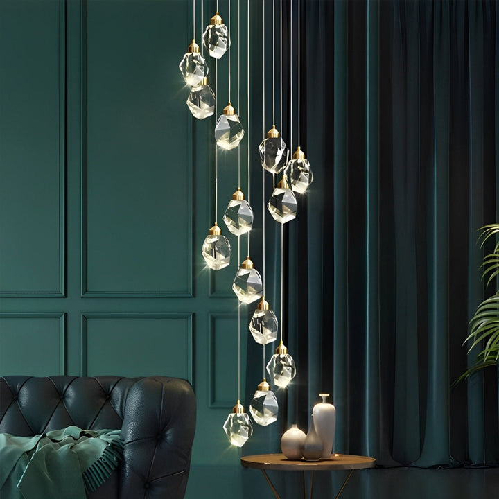 Lámpara cascada de cristal dorado. Candelabro espiral moderno para iluminación.