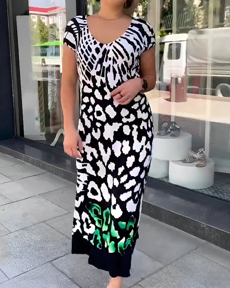 Ropa femenina: Vestido midi casual negro con estampado moderno, estilo fluido y escote V. Perfecto para verano.