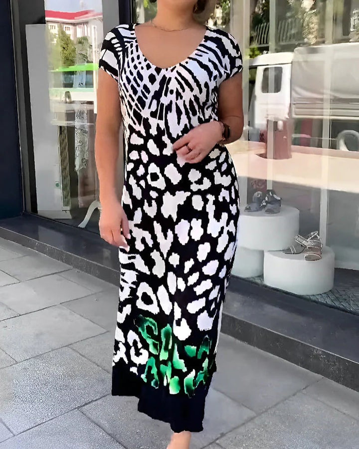 Ropa femenina: Vestido midi casual negro con estampado moderno, estilo fluido y escote V. Perfecto para verano.