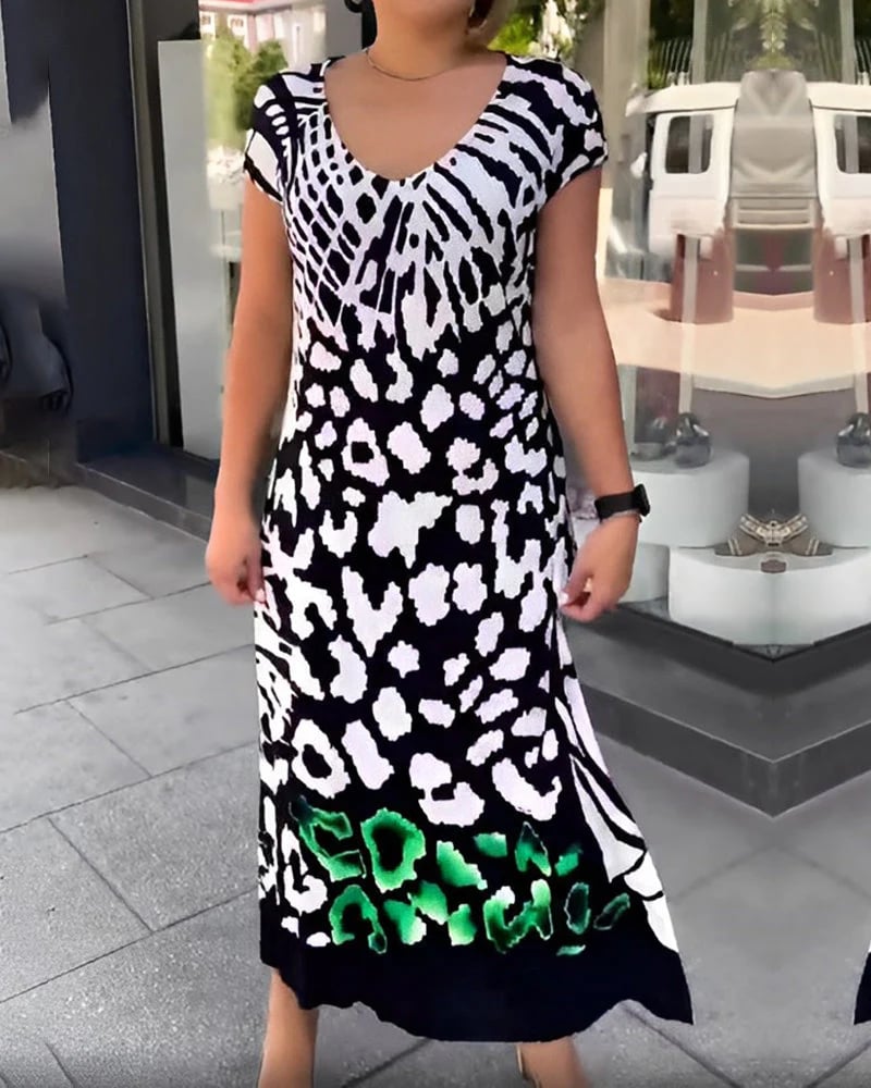 Vestido midi negro casual para mujer, con estampado moderno, escote V y estilo fluido. Ideal para el verano.