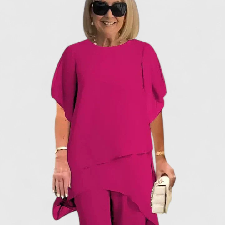 Conjunto versátil de dos piezas en rojo rosa para mujer. Estilo elegante y moderno, disponible en tallas grandes.
