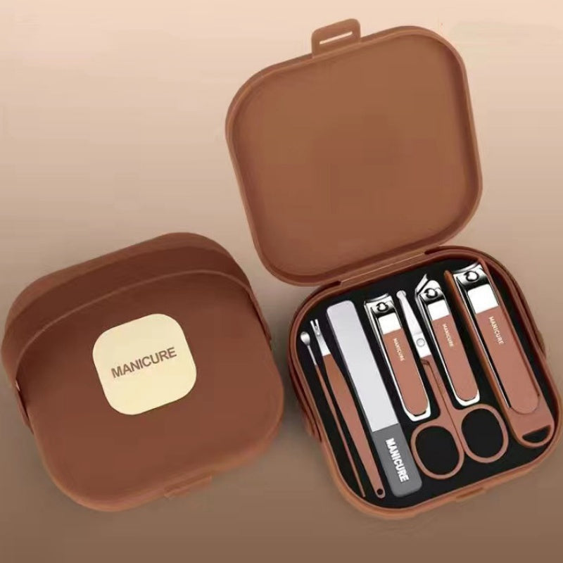 Set de manicura portátil unisex de 7 piezas con cortauñas de acero carbono. Perfecto para viaje y cuidado personal.
