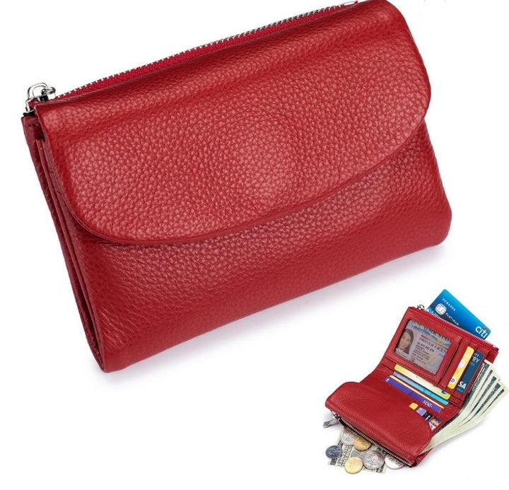 Billetera compacta de piel con ranuras para tarjetas, doble monedero y protección RFID. Muy funcional.