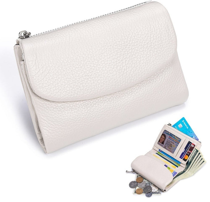 Detalle de piel genuina: Cartera compacta con textura suave, RFID y doble monedero. Calidad superior.
