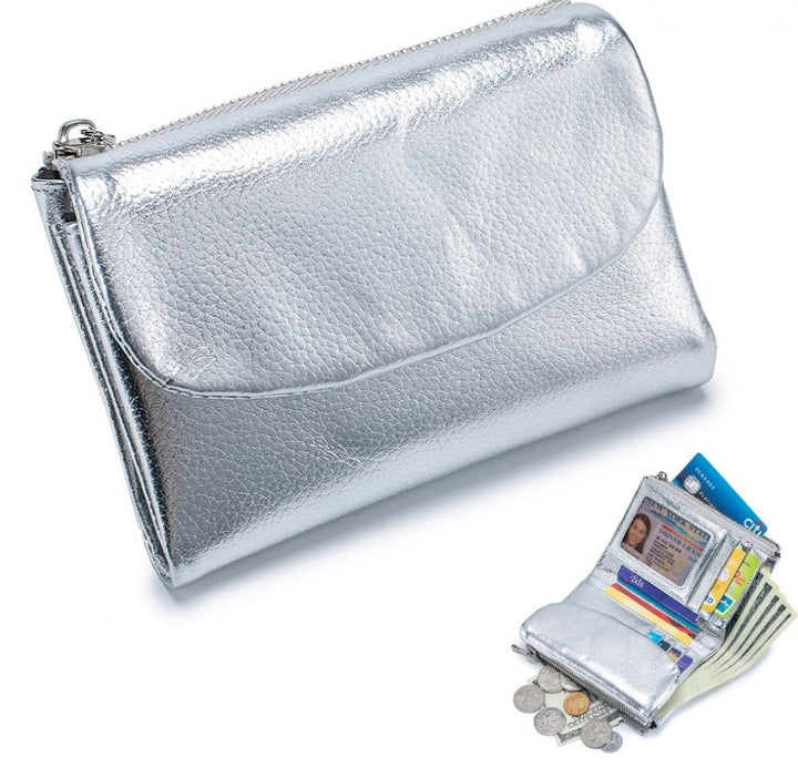 Billetera de piel unisex compacta. Organiza tus tarjetas y monedas con RFID para mayor tranquilidad.