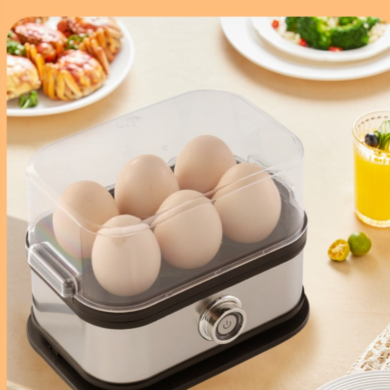 Vaporera de huevos eléctrica con tapa transparente, ideal para huevos cocidos perfectos.